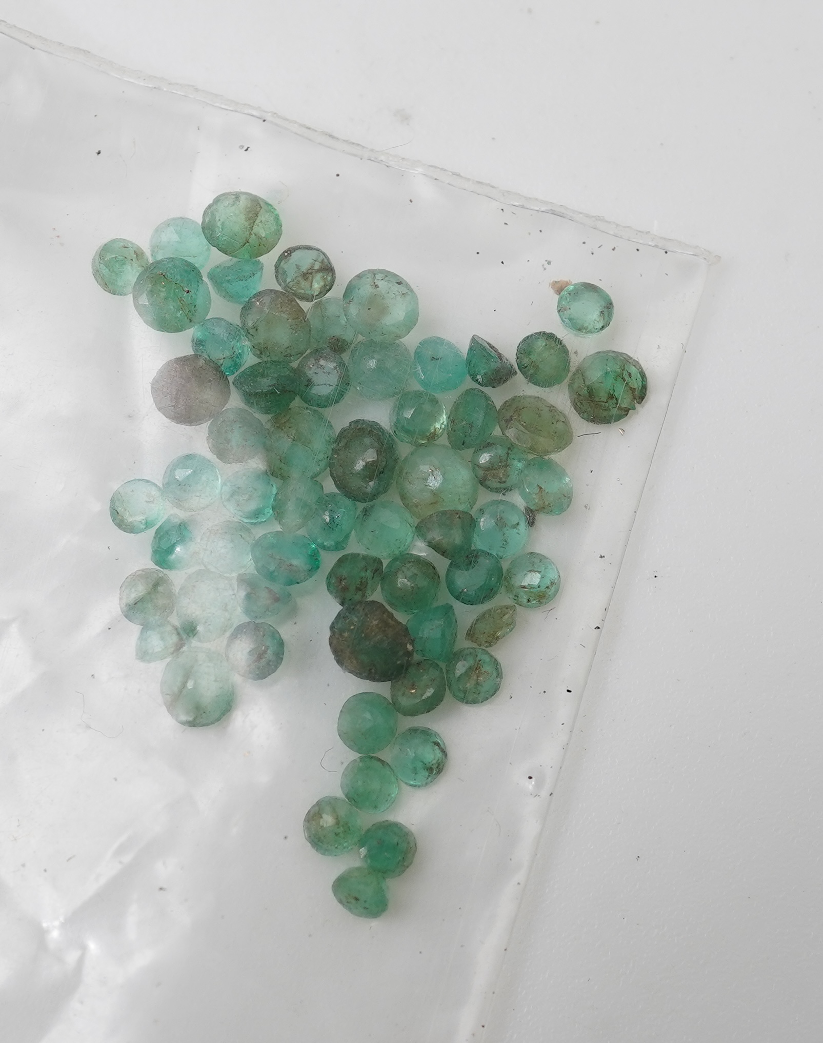 A collection of loose emeralds